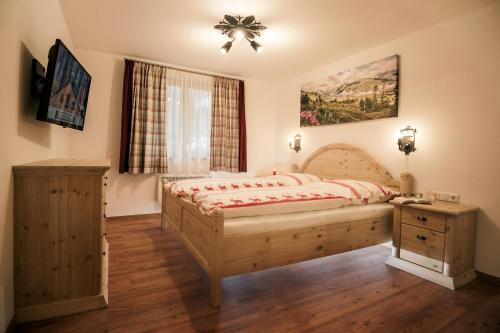 a bedroom with a large bed and a window at Haus Klaffenböck in Bad Gastein