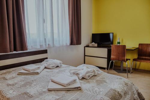 Ένα ή περισσότερα κρεβάτια σε δωμάτιο στο Apartmany Gino Besenova