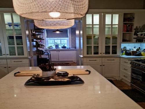 a kitchen with a large white counter top with at Kevacy Farm Lodge in Clarens