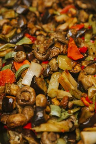a pile of food with mushrooms and vegetables at Rtanj Kopaonik Eco Resort & Spa in Kopaonik