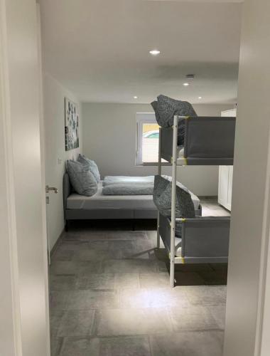 Кровать или кровати в номере Greenhome Lörrach -Ihre Unterkunft im 3-Ländereck-
