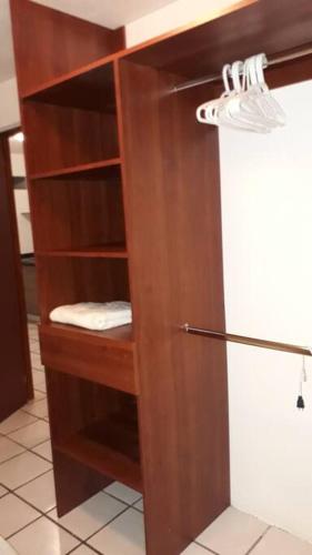 a wooden shelf in a kitchen with a sink at Casa Ejecutivo Zona Iteso Bahía de Acapulco in Guadalajara