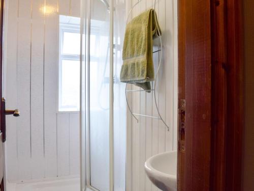 a bathroom with a shower and a sink at Springfields in Leek