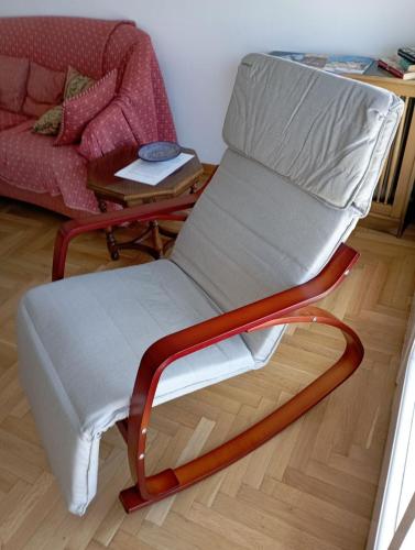 a chair sitting in a living room next to a couch at SEAVIEW KAVALA PORT in Kavala