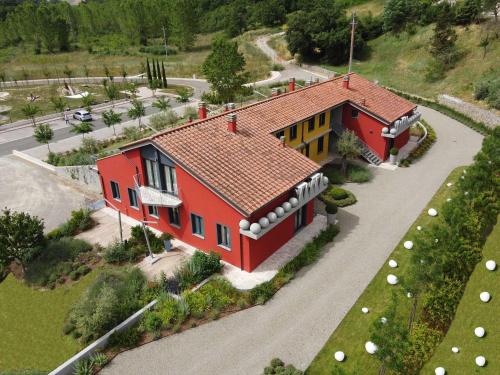 a model of a house with a red roof at Bocelli Guest House in Laiatico