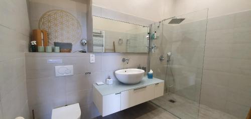 a white bathroom with a sink and a shower at Best seaview Penthouse+77m2 privat roof terrace near beach and Cannes in Vallauris