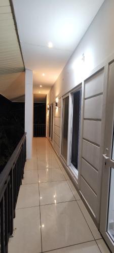 a hallway of a house with a balcony at Shawn Dale Homestay in Ramakkalmedu