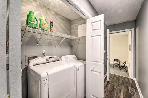 a small laundry room with a washer and dryer at Classic Murfreesboro Home with Grill and Yard! in Murfreesboro