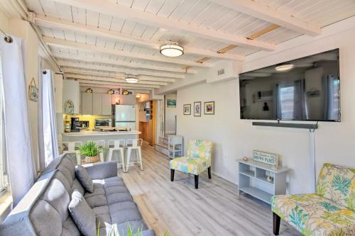 a living room with a couch and a kitchen at Key Largo Home with Dock and Private Beach Access in Key Largo