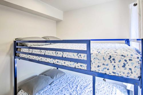 a blue bunk bed in a room with a bed at Key Largo Home with Dock and Private Beach Access in Key Largo