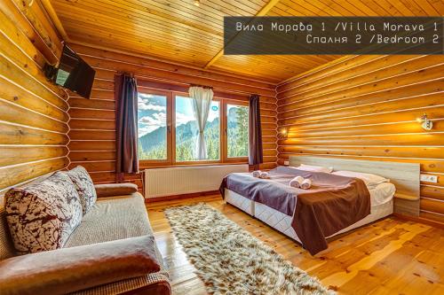 a bedroom with a bed and a couch in a room at Вила Морава in Pamporovo