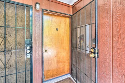 a room with a door and a glass wall at Kaunakakai Escape Heated Pool and Beach Access in Kaunakakai