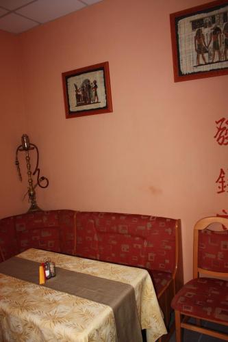 a room with a bed and a table and a chair at Hotel Gostynnyi Dvir in Bucha