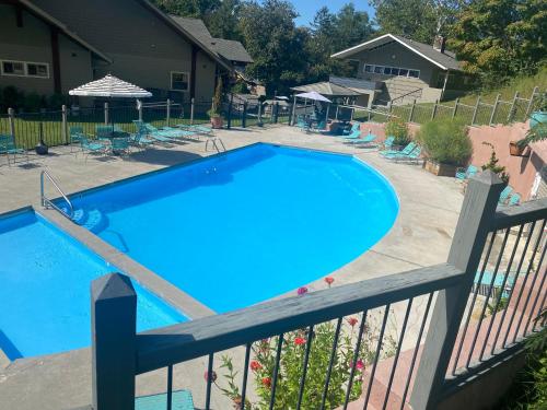 a swimming pool on a balcony with a fence at Country Town N' Suites in Gatlinburg