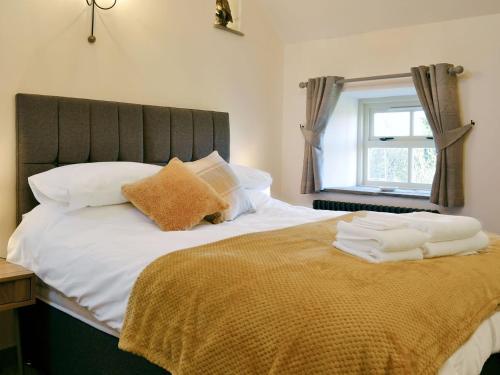 Кровать или кровати в номере Broats Barn
