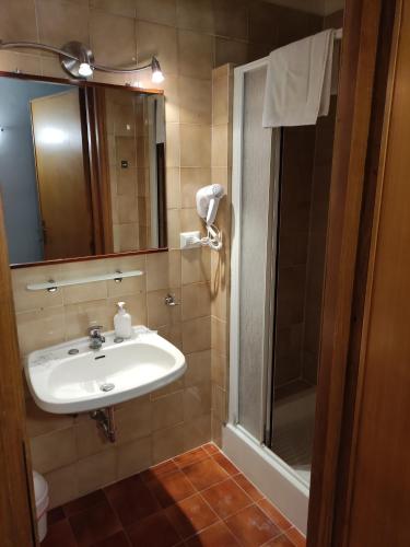 a bathroom with a sink and a shower at Hotel Big Bang in Rome