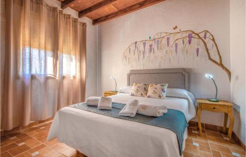 a bedroom with a bed with towels on it at 4 Bedroom Cozy Home In Cartagena in Fuente-Álamo de Murcia