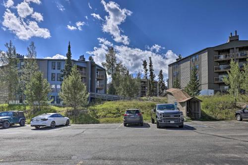 a parking lot with cars parked in front of a building at Ski Shuttle and Pool Modern Silverthorne Condo! in Silverthorne