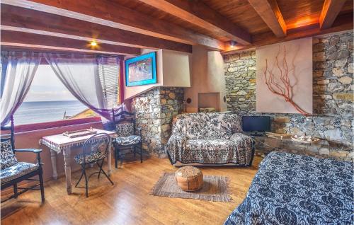 a living room with a couch and a table at Cozy Home In Recco With House Sea View in Recco