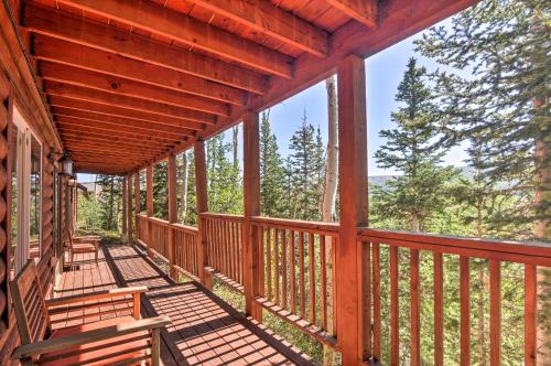 a porch of a cabin with benches on it at Less Than 1 Mi to Brian Head Resort Mtn-View Gem with Deck in Brian Head
