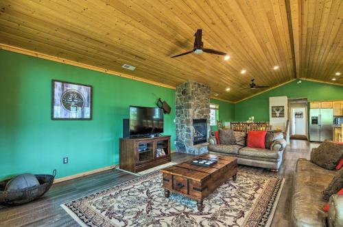 a living room with a couch and a tv at Less Than 1 Mi to Brian Head Resort Mtn-View Gem with Deck in Brian Head
