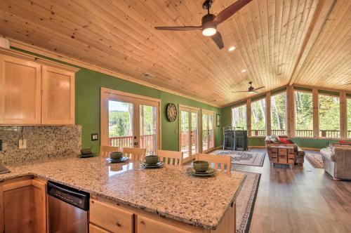 a kitchen with a counter top in a room with a living room at Less Than 1 Mi to Brian Head Resort Mtn-View Gem with Deck in Brian Head