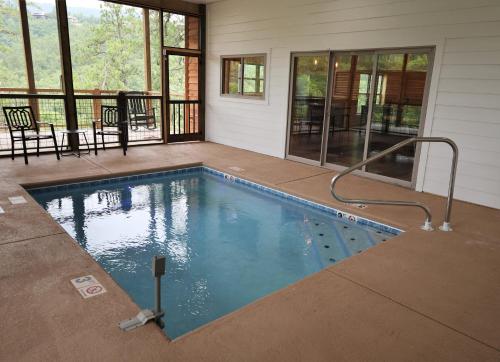 a swimming pool in the middle of a house at Woodland Cove in Waldens Creek