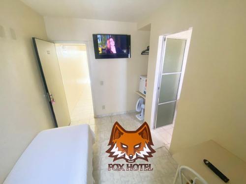 a bathroom with a room with a fox house sign on the floor at Fox Hotel Montes Claros in Montes Claros