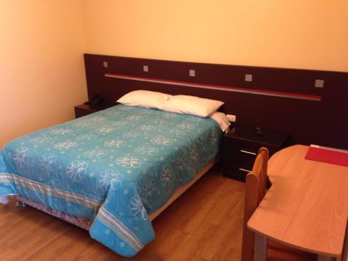 Postel nebo postele na pokoji v ubytování Hotel Los Cocos