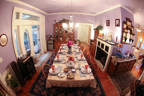 a large dining room with a long table with food on it at Center Harbor Sutton House B & B in Center Harbor