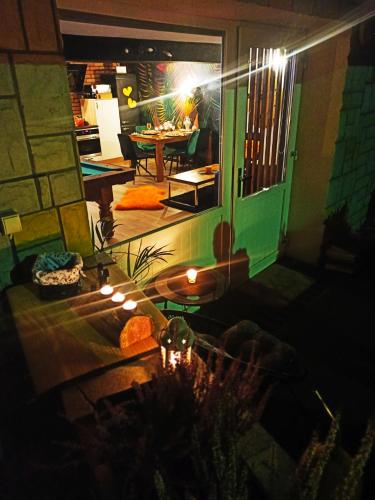 a view of a room with a table and lights at Apartamencik za lasem in Krynica Zdrój