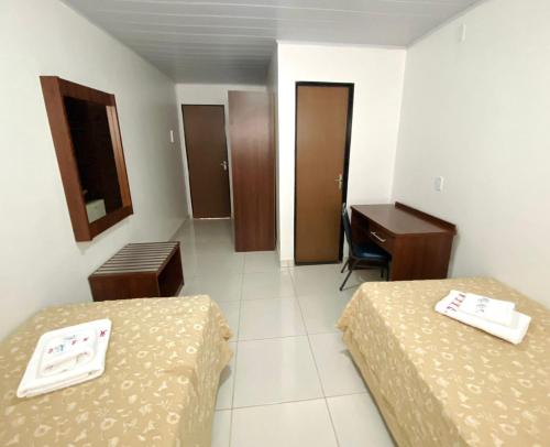 Ένα ή περισσότερα κρεβάτια σε δωμάτιο στο Hotel Alexânia