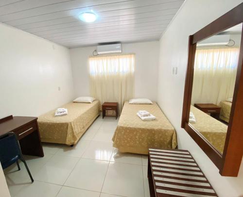 Ένα ή περισσότερα κρεβάτια σε δωμάτιο στο Hotel Alexânia
