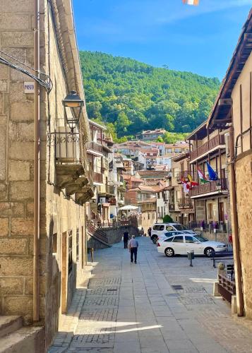 a city street with people walking down the street at Casa Artista in Pedro Bernardo