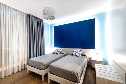 Кровать или кровати в номере Zaffiro Lavico rooms Etna nature sea