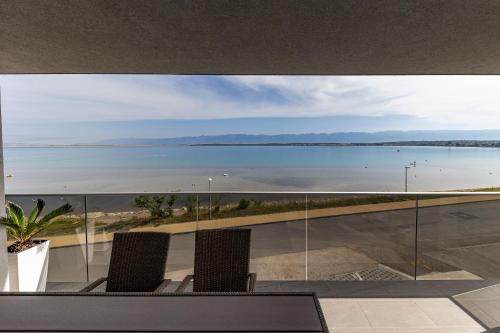 a view of the ocean from the balcony of a house at Golden Nin in Nin