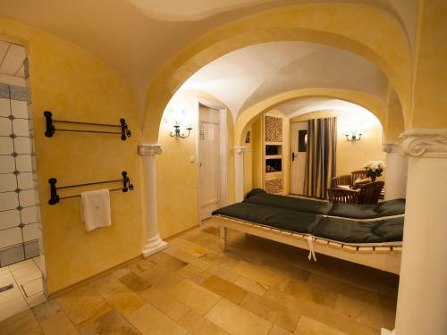 a bedroom with a large bed in a room at Landhaus Benediktenhof in Bad Tölz