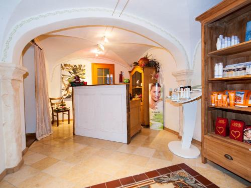 a room with an archway and a counter in a pharmacy at Landhaus Benediktenhof in Bad Tölz
