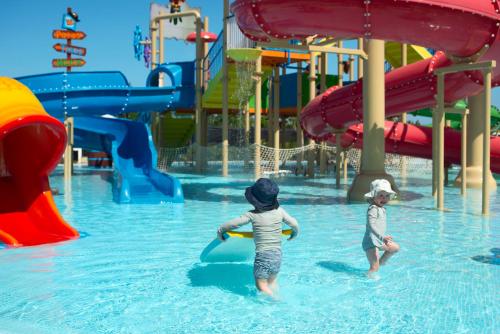 two children playing in the water at a water park at Ocean Coral Spring Resort - All Inclusive in Falmouth