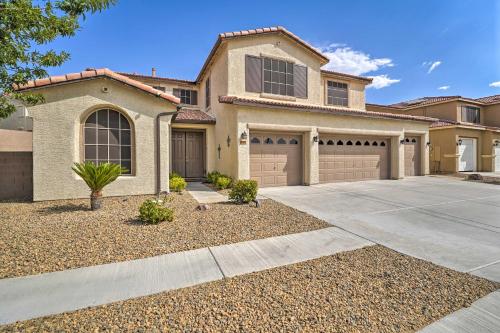 a house with two garage doors and a driveway at about 3,900 Sq Ft North Vegas Escape with RV Parking! in Las Vegas