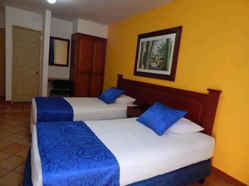 Letto o letti in una camera di Hotel Castillo Real