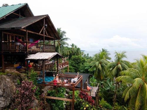 a group of people sitting in a resort at Casa Balae in Nuquí