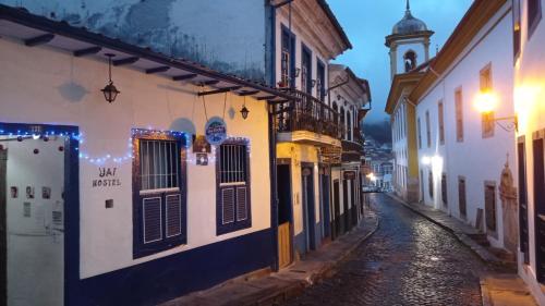 a street in an old town at night at Hostel Uai in Ouro Preto