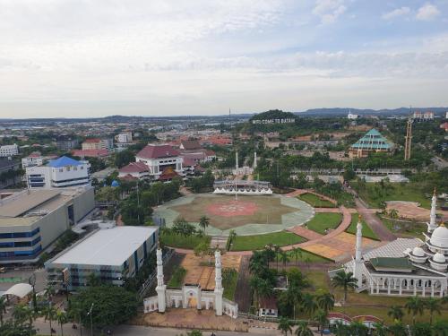 an aerial view of a city with a park at CozyHomes at One Residence Batam in Batam Center
