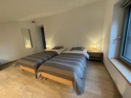 Katil atau katil-katil dalam bilik di Holiday home in Walloon Ardennes