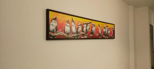 a painting hanging on a wall on a wall at Roxy Hotel Sri Aman in Simanggang