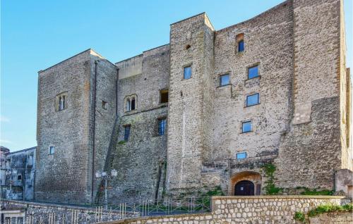 a large stone building with two towers at Gorgeous Home In Carano With Kitchen in Carano