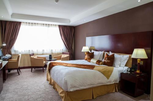 Grand Legacy Hotelにあるベッド