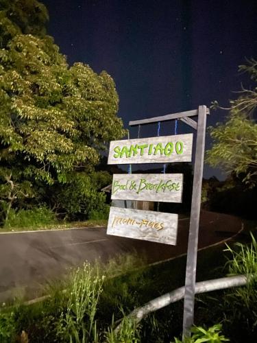 a sign on the side of a road at Santiago Bed and Breakfast at Desa Wisata Moni in Kelimutu