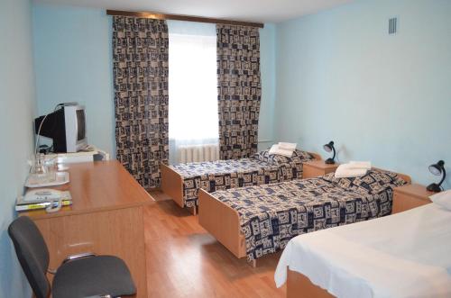 Voodi või voodid majutusasutuse Predslava Hotel toas